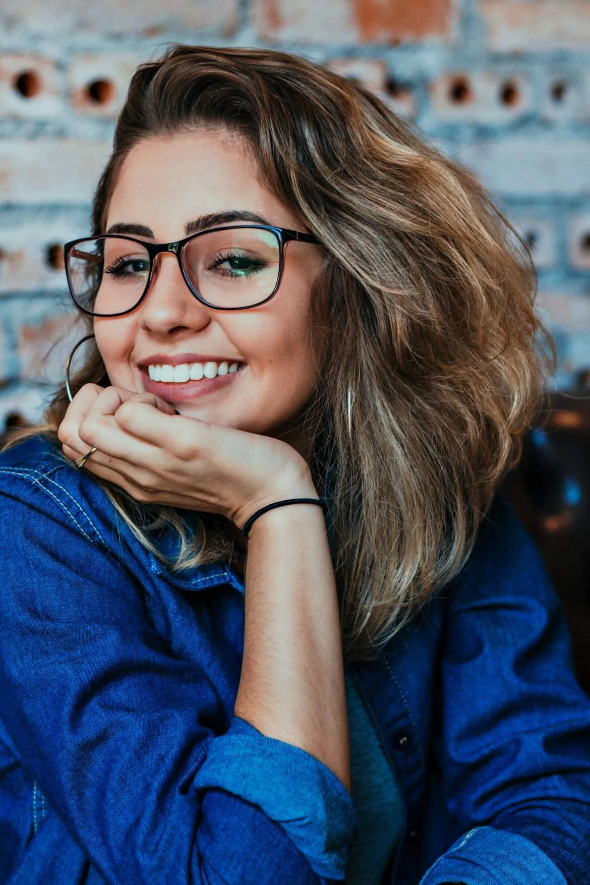 A woman smiling outdoors